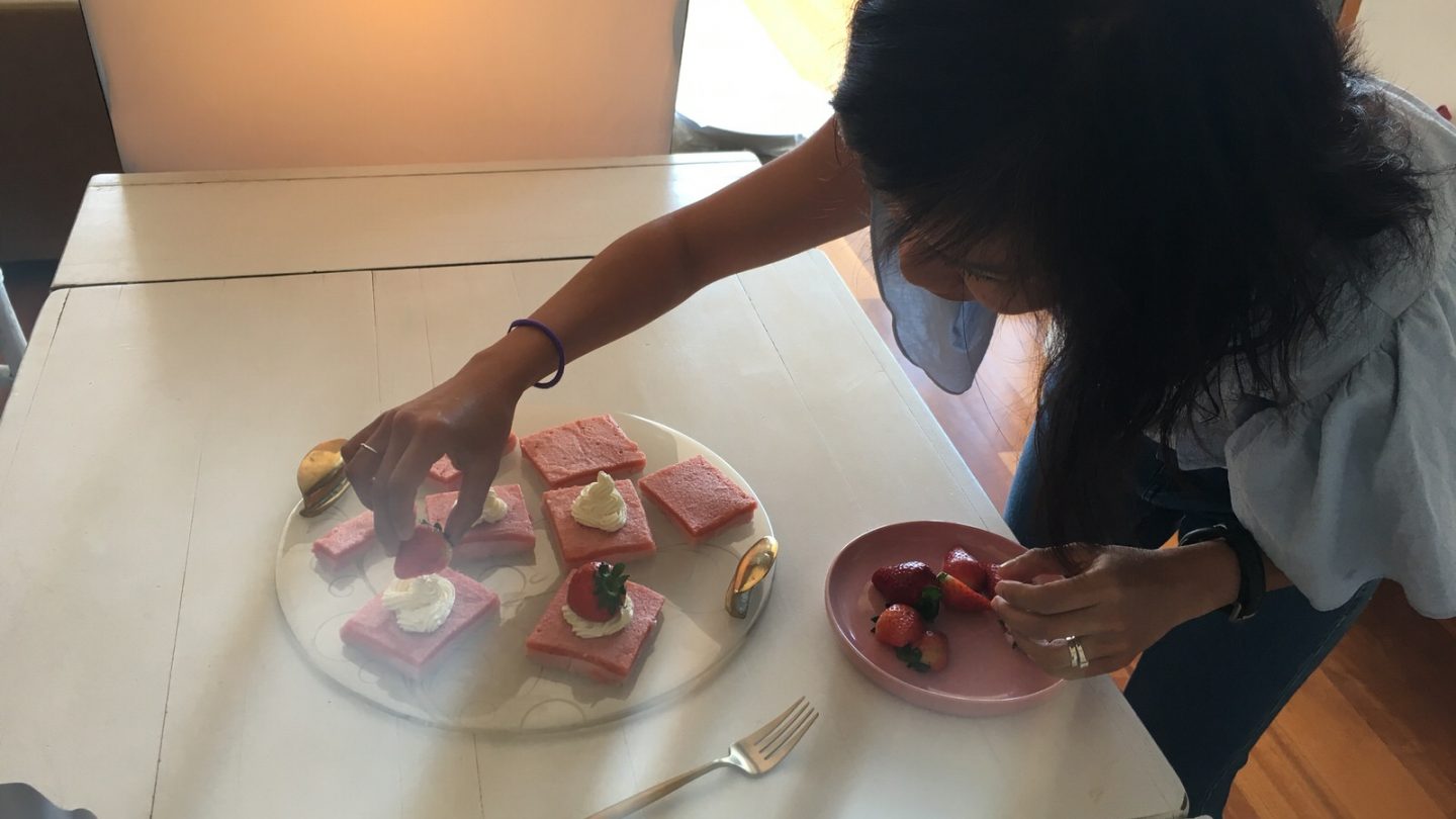 Ali plating up strawberry slice for shoot
